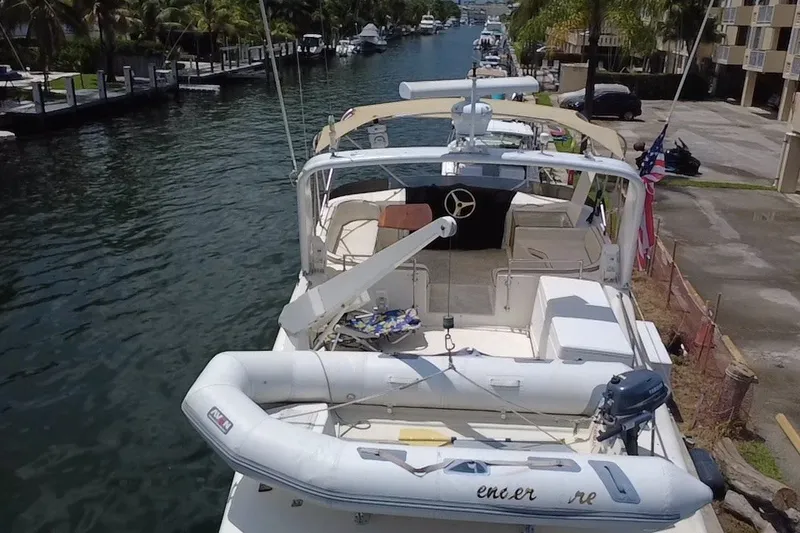 Slide: The Image of 1989 Ocean Yachts 48 Motor Yacht docked with inflatable boat on deck. - 128