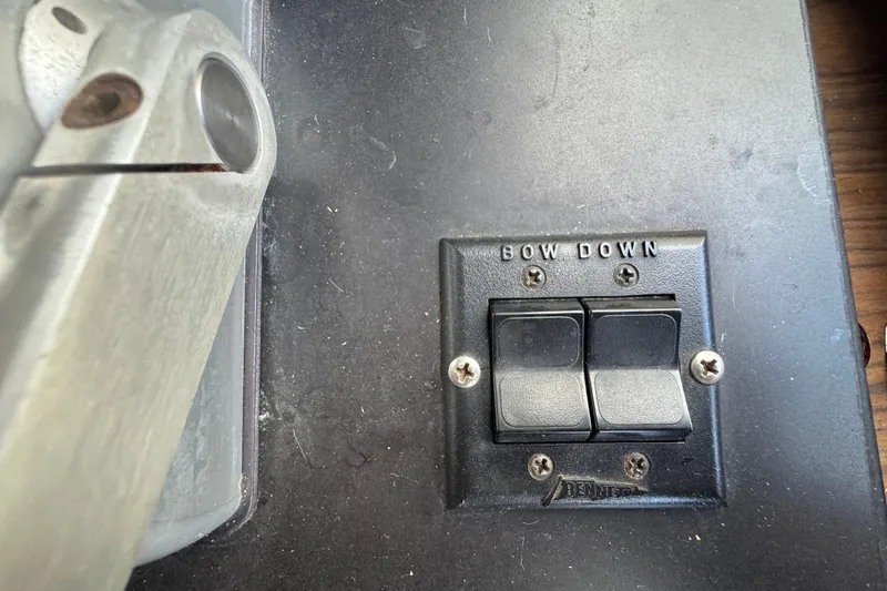 Slide: The Image of Control panel of a 1989 Ocean Yachts 48 Motor Yacht with "Bow Down" switches. - 83