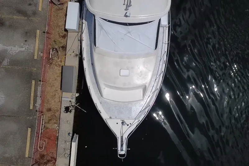 Slide: The Image of Aerial view of a 1989 Ocean Yachts 48 Motor Yacht docked by the water. - 121