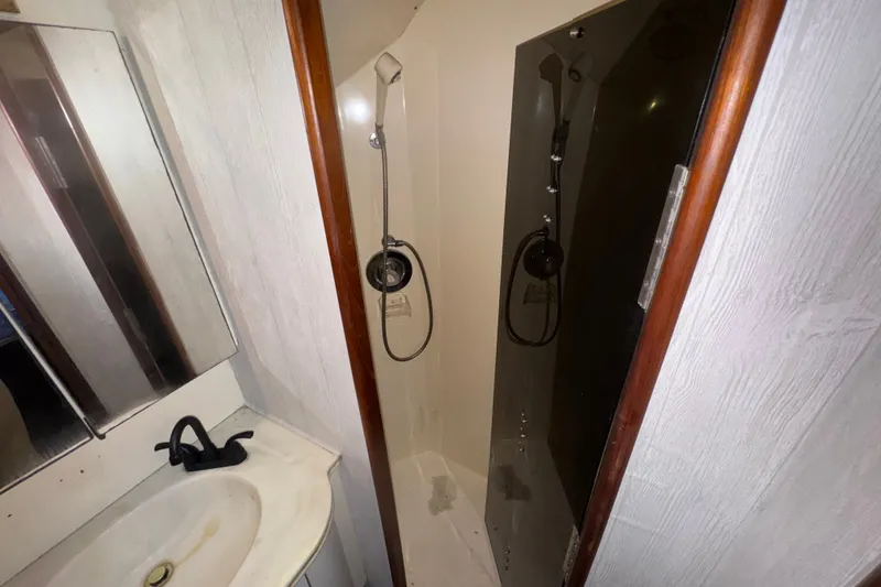 Slide: The Image of Bathroom interior of 1989 Ocean Yachts 48 Motor Yacht with shower and sink. - 96