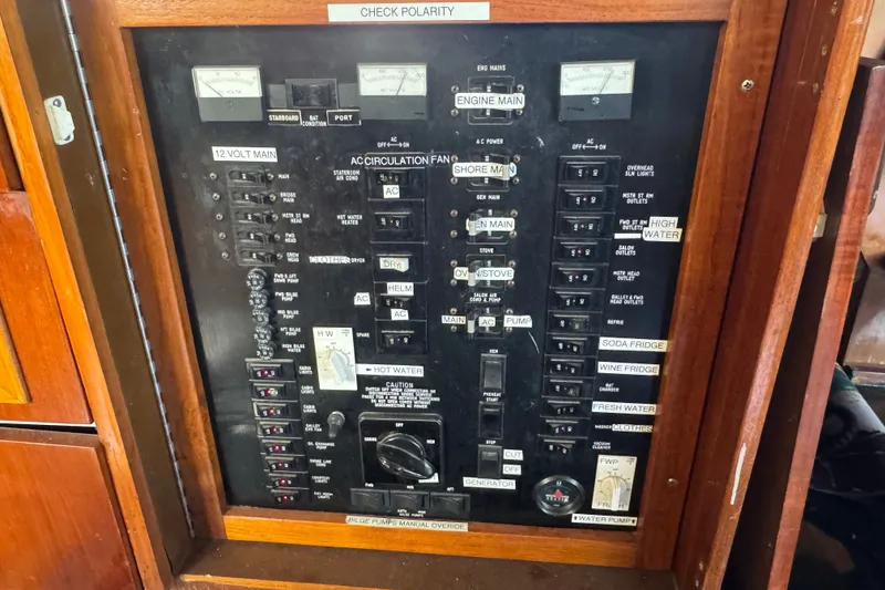 Slide: The Image of Electrical panel of a 1989 Ocean Yachts 48 Motor Yacht with various switches and gauges. - 64