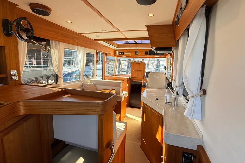 Slide: The Image of Luxurious interior of 2024 Targa 37 boat with wooden finishes and modern amenities. - 16