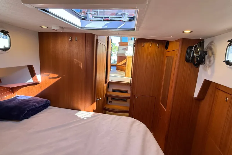 Slide: The Image of Interior of 2024 Targa 37 boat cabin with wooden finish and skylight. - 48