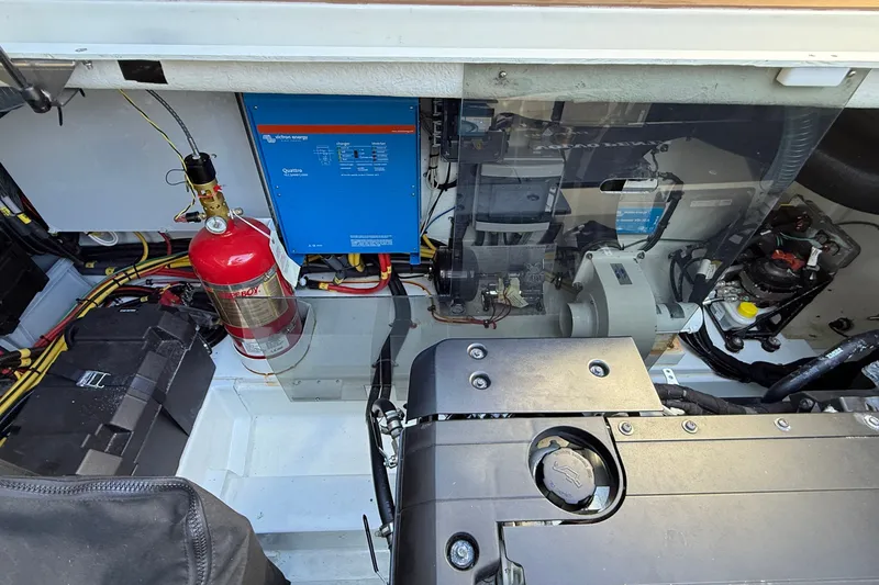 Slide: The Image of Engine compartment of 2024 Targa 37 boat with fire extinguisher and electrical components. - 69