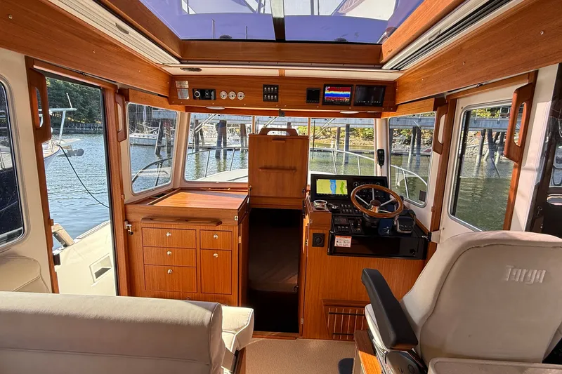 Slide: The Image of Interior of 2024 Targa 37 boat with wooden finish and modern navigation equipment. - 30