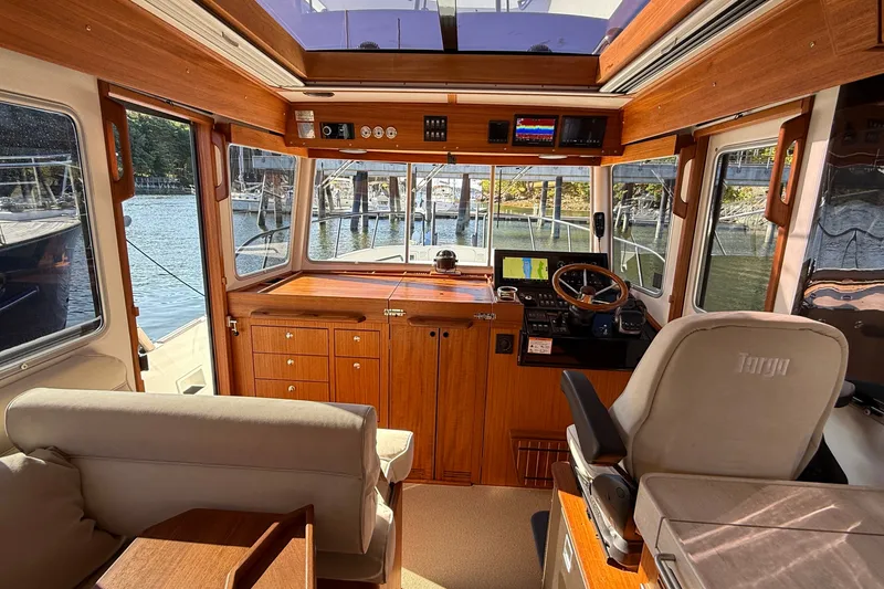 Slide: The Image of Interior of 2024 Targa 37 boat with wooden finish and modern navigation equipment. - 29