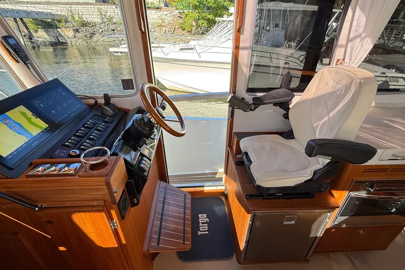 Slide: The Image of Helm of 2024 Targa 37 boat with modern controls and comfortable seating. - 40