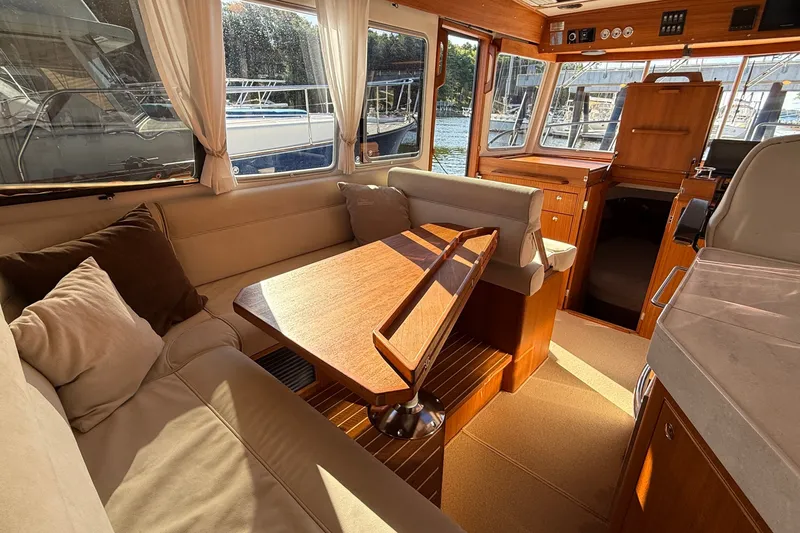 Slide: The Image of Luxurious interior of 2024 Targa 37 yacht with elegant wood finishes and comfortable seating. - 17