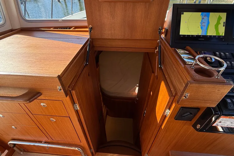 Slide: The Image of Interior of 2024 Targa 37 boat with wooden cabinetry and navigation system. - 42