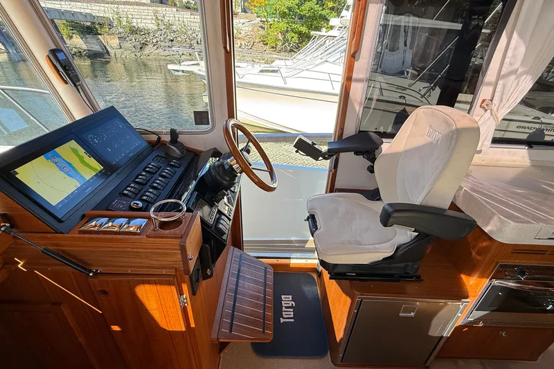 Slide: The Image of 2024 Targa 37 boat cockpit with navigation system and captain's chair. - 41