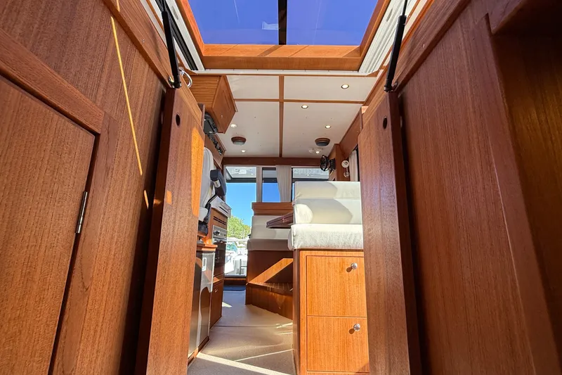 Slide: The Image of Interior of 2024 Targa 37 boat, featuring elegant wood paneling and modern design elements. - 52