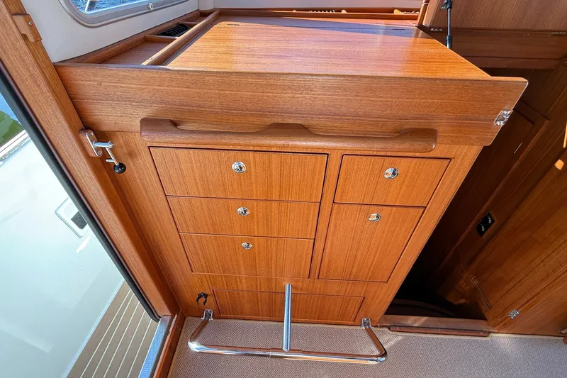 Slide: The Image of 2024 Targa 37 interior with wooden cabinetry and chrome accents. - 37