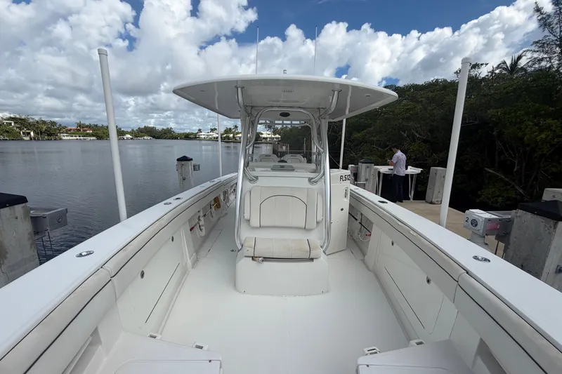 Slide: The Image of 2014 Jupiter 34 FS boat docked by a scenic waterfront under a cloudy sky. - 72