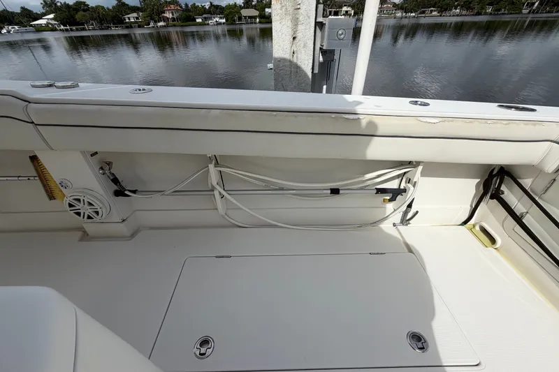 Slide: The Image of 2014 Jupiter 34 FS boat interior with storage compartment and water view. - 14
