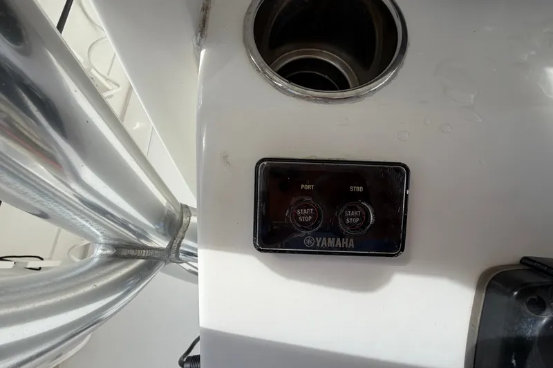 Slide: The Image of Control panel on a 2014 Jupiter 34 FS boat with Yamaha start-stop buttons. - 30