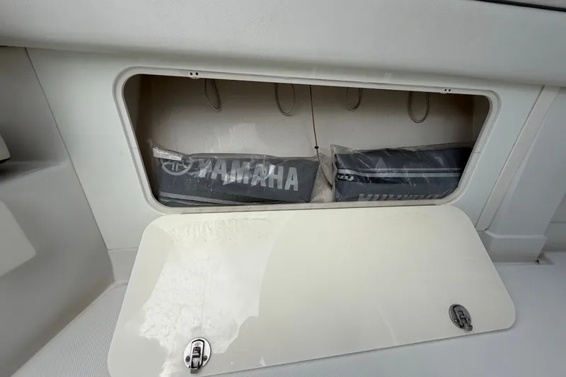 Slide: The Image of Storage compartment on a 2014 Jupiter 34 FS boat with Yamaha accessories. - 43