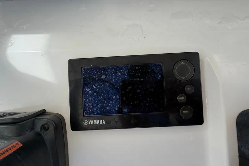 Slide: The Image of Yamaha control panel on 2014 Jupiter 34 FS boat dashboard. - 29