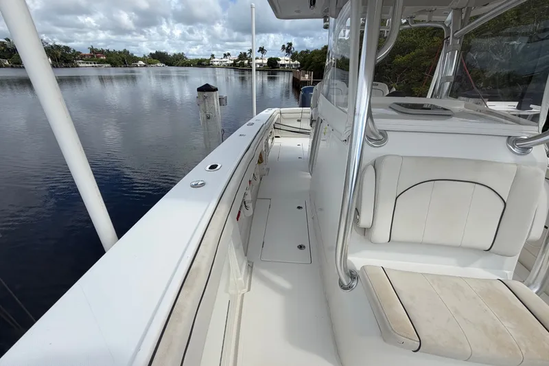 Slide: The Image of 2014 Jupiter 34 FS boat docked on calm water under cloudy skies. - 47