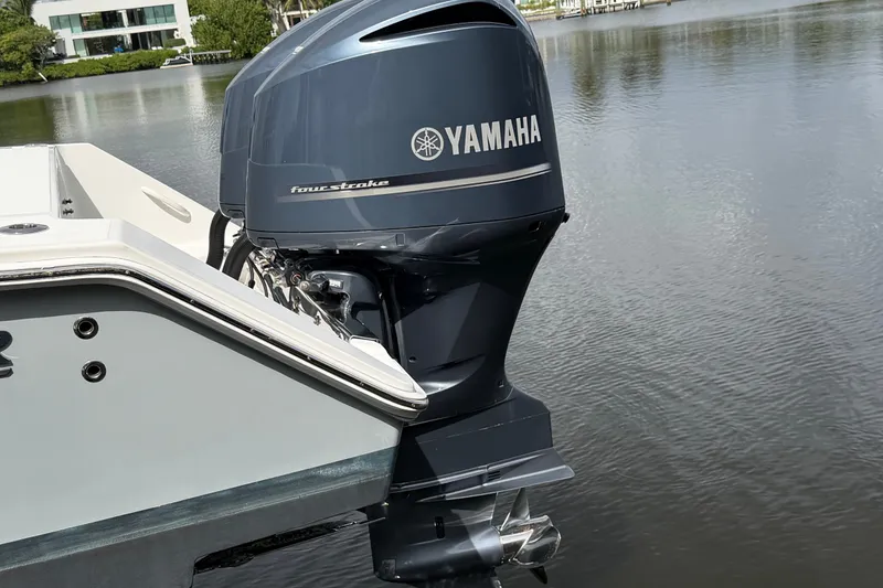 Slide: The Image of 2014 Jupiter 34 FS boat with Yamaha four-stroke outboard motor on calm water. - 7