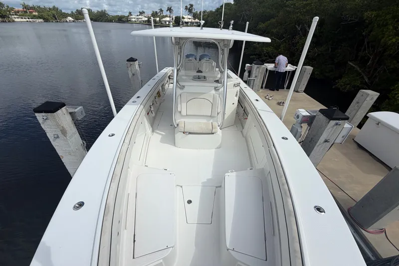 Slide: The Image of 2014 Jupiter 34 FS boat docked by a calm waterfront. - 70