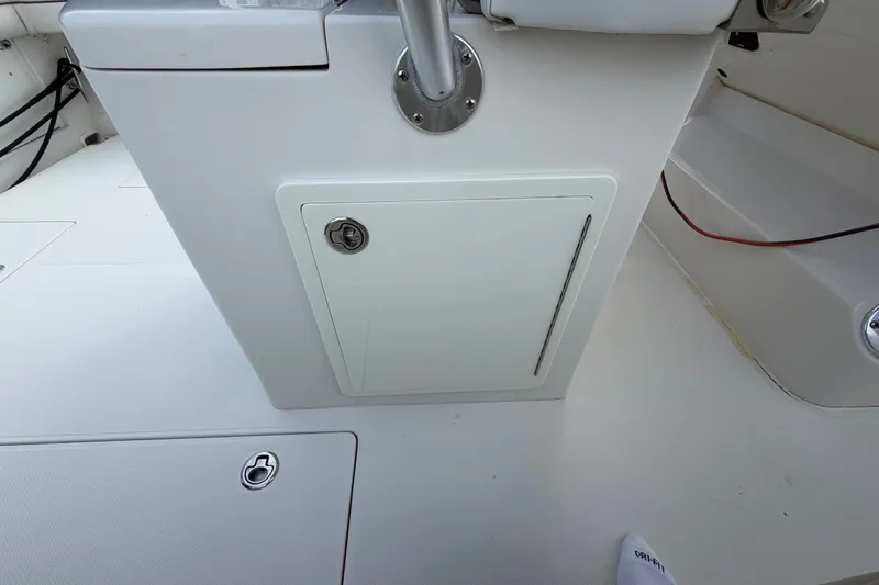 Slide: The Image of 2014 Jupiter 34 FS boat interior with storage compartment and seating area. - 36