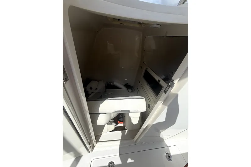 Slide: The Image of Interior view of a 2015 Jupiter 34 FS boat compartment with storage space. - 13