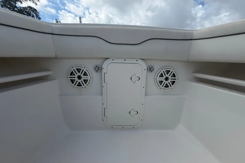 Slide: The Image of Interior view of a 2014 Jupiter 34 FS boat with speakers and storage compartment. - 62