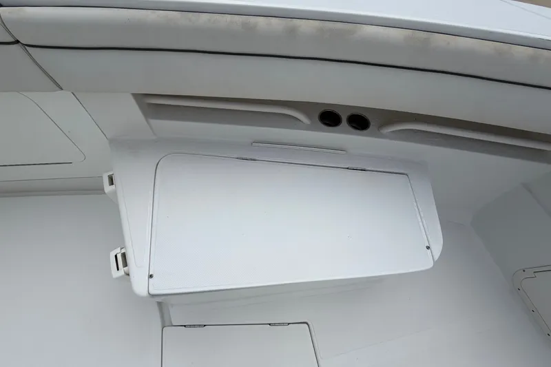 Slide: The Image of 2014 Jupiter 34 FS boat interior with storage compartment and seating area. - 56
