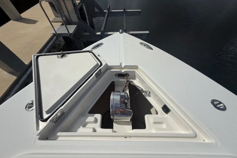 Slide: The Image of Bow of 2014 Jupiter 34 FS boat with open anchor locker at dock. - 66
