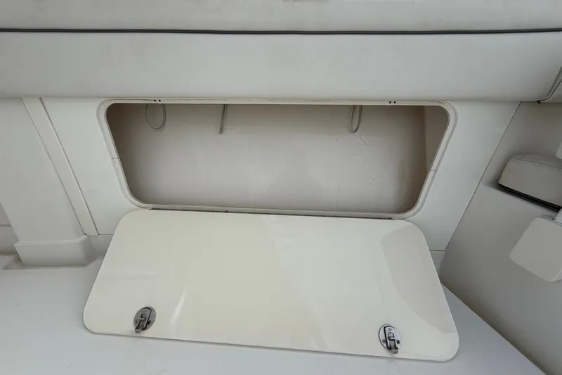 Slide: The Image of Open storage compartment on a 2014 Jupiter 34 FS boat interior. - 46