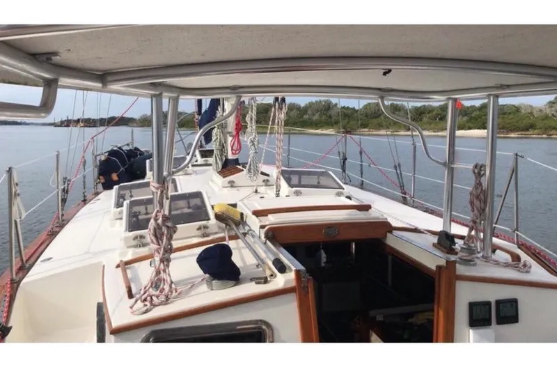Slide: The Image of The image shows the deck of a 1978 CSY 37 sailboat, focusing on the cockpit area. - 3