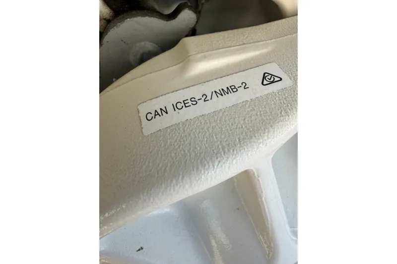 Slide: The Image of Close-up of a 1977 Mako 235 part with CAN ICES-2/NMB-2 label. - 39