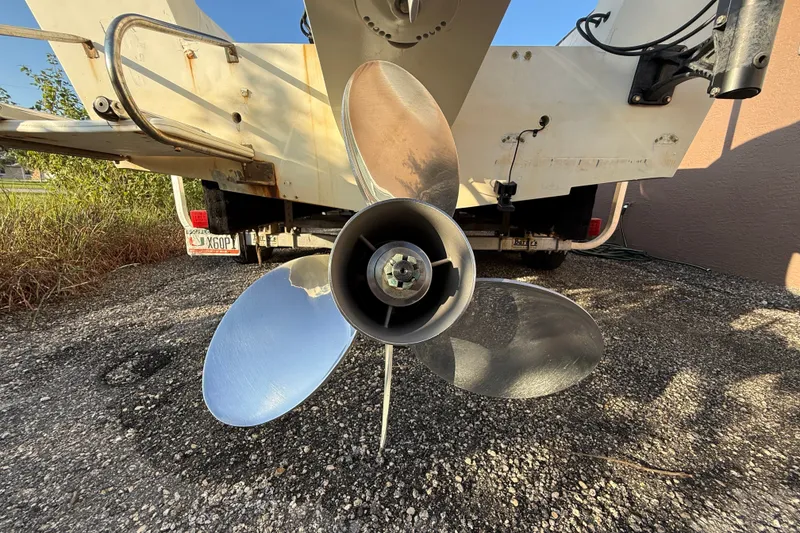 Slide: The Image of Rear view of a 1977 Mako 235 boat showing a shiny propeller. - 5