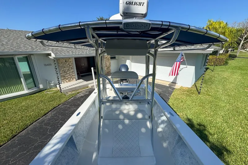 Slide: The Image of 1972 Cuda Craft Open Fisherman boat with T-top, parked in a residential driveway. - 50