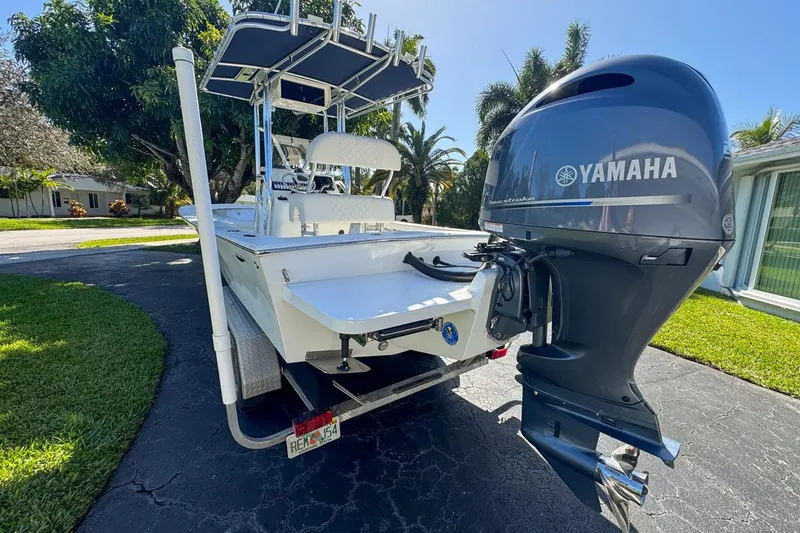 Slide: The Image of 1972 Cuda Craft Open Fisherman boat with Yamaha outboard motor on driveway. - 74