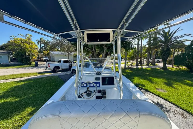 Slide: The Image of 1972 Cuda Craft Open Fisherman boat with modern console and canopy in a sunny neighborhood. - 15