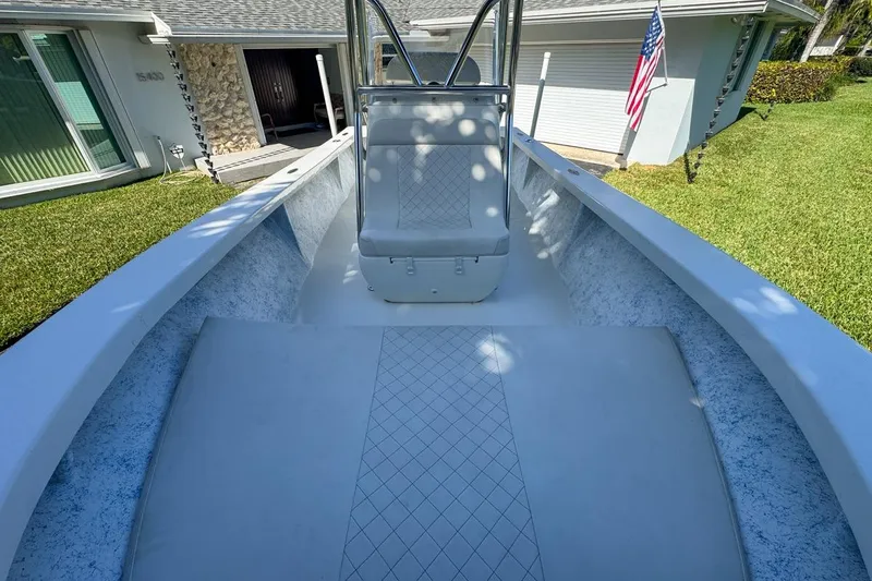 Slide: The Image of 1972 Cuda Craft Open Fisherman boat in a residential driveway, showcasing sleek design. - 46