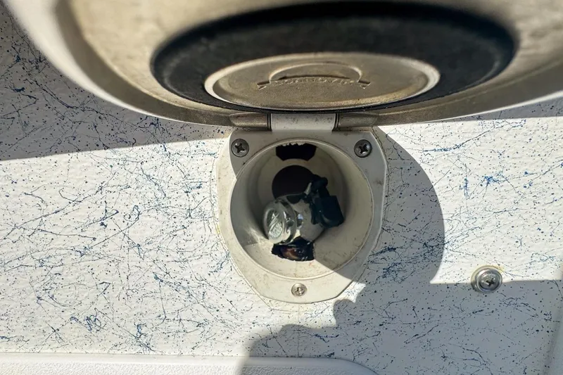 Slide: The Image of 1972 Cuda Craft Open Fisherman boat ignition switch with key inserted. - 69