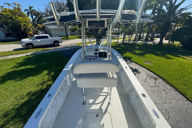 Slide: The Image of 1972 Cuda Craft Open Fisherman boat with T-top, parked on a sunny driveway. - 13