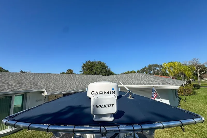 Slide: The Image of 1972 Cuda Craft Open Fisherman boat with Garmin and Golight equipment, clear sky background. - 51