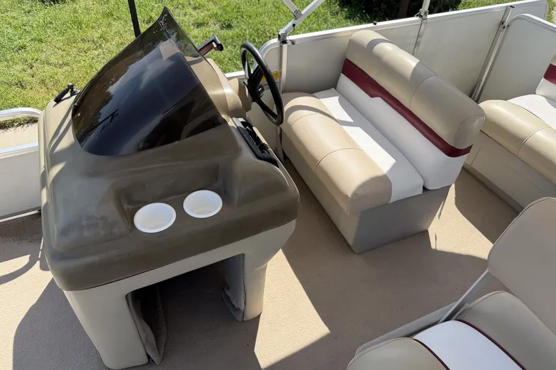 Slide: The Image of 1997 Sun Tracker Party Barge 21 Signature Series interior with helm and seating. - 20