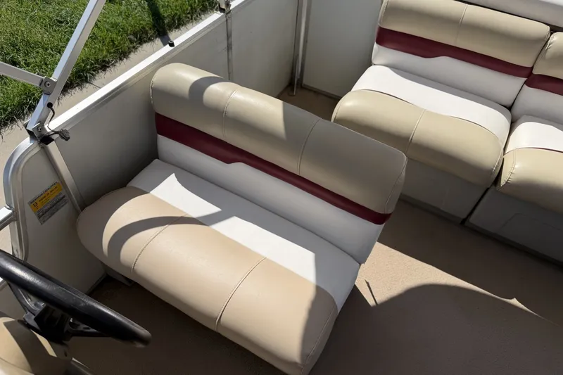 Slide: The Image of 1997 Sun Tracker Party Barge 21 Signature Series interior seating with beige and maroon upholstery. - 22