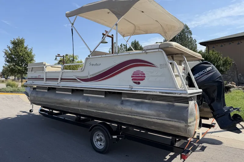 The Image of 1997 SUNTRACKER Party Barge 21 pontoon boat with canopy and Mercury outboard motor. - 0