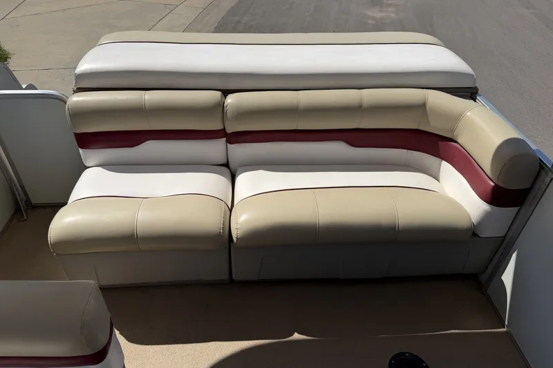 Slide: The Image of 1997 SUNTRACKER Party Barge 21 boat seating with beige and maroon upholstery. - 15