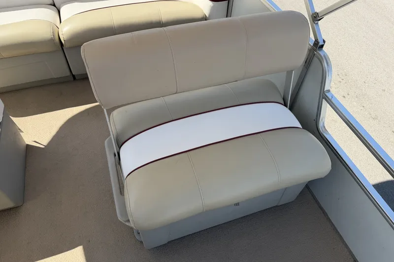 Slide: The Image of 1997 Sun Tracker Party Barge 21 Signature Series boat seating, beige upholstery with white accent. - 14