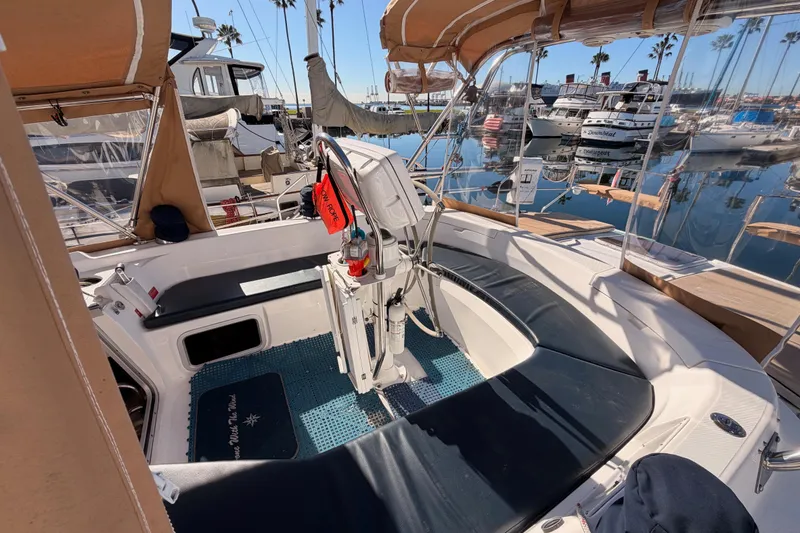 Slide: The Image of 2005 Hunter Passage 456 sailboat cockpit with seating, docked at marina. - 24