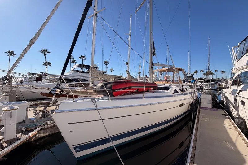 Slide: The Image of 2005 Hunter Passage 456 yacht docked at marina with clear blue sky. - 4