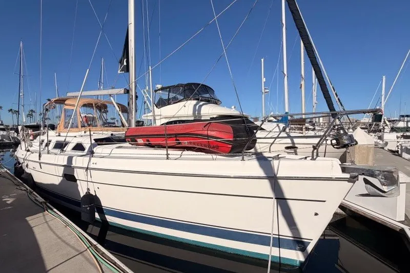 The Image of 2005 Hunter Passage 456 sailboat docked in marina under clear blue sky. - 0