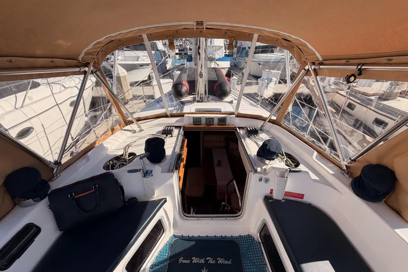 Slide: The Image of Interior view of a 2005 Hunter Passage 456 sailboat cockpit with seating and navigation equipment. - 29