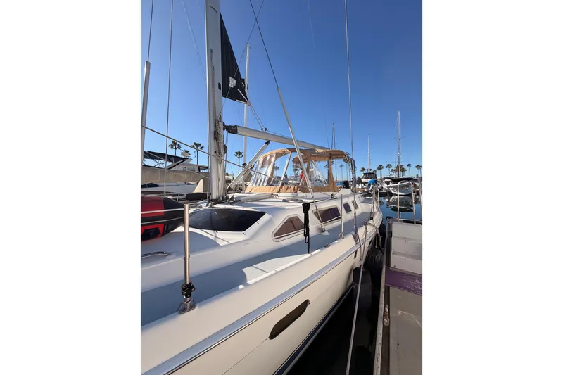 Slide: The Image of 2005 Hunter Passage 456 sailboat docked in sunny marina, clear blue sky. - 6